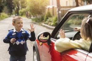 front-view-kid-waving-mother